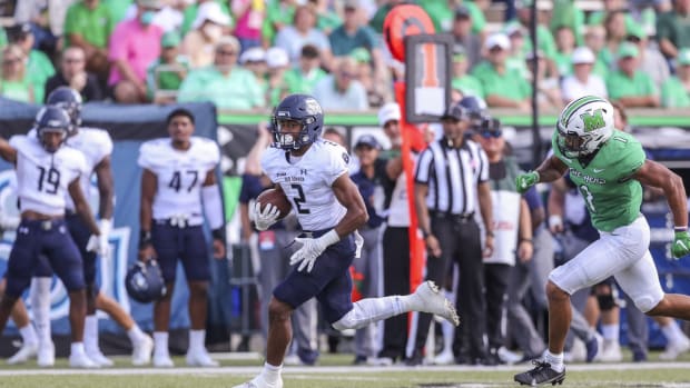 Oct 9, 2021; Huntington, West Virginia, USA; Old Dominion Monarchs running back Blake Watson (2) runs the ball during the first quarter against the Marshall Thundering Herd at Joan C. Edwards Stadium. Mandatory Credit: Ben Queen-USA TODAY Sports